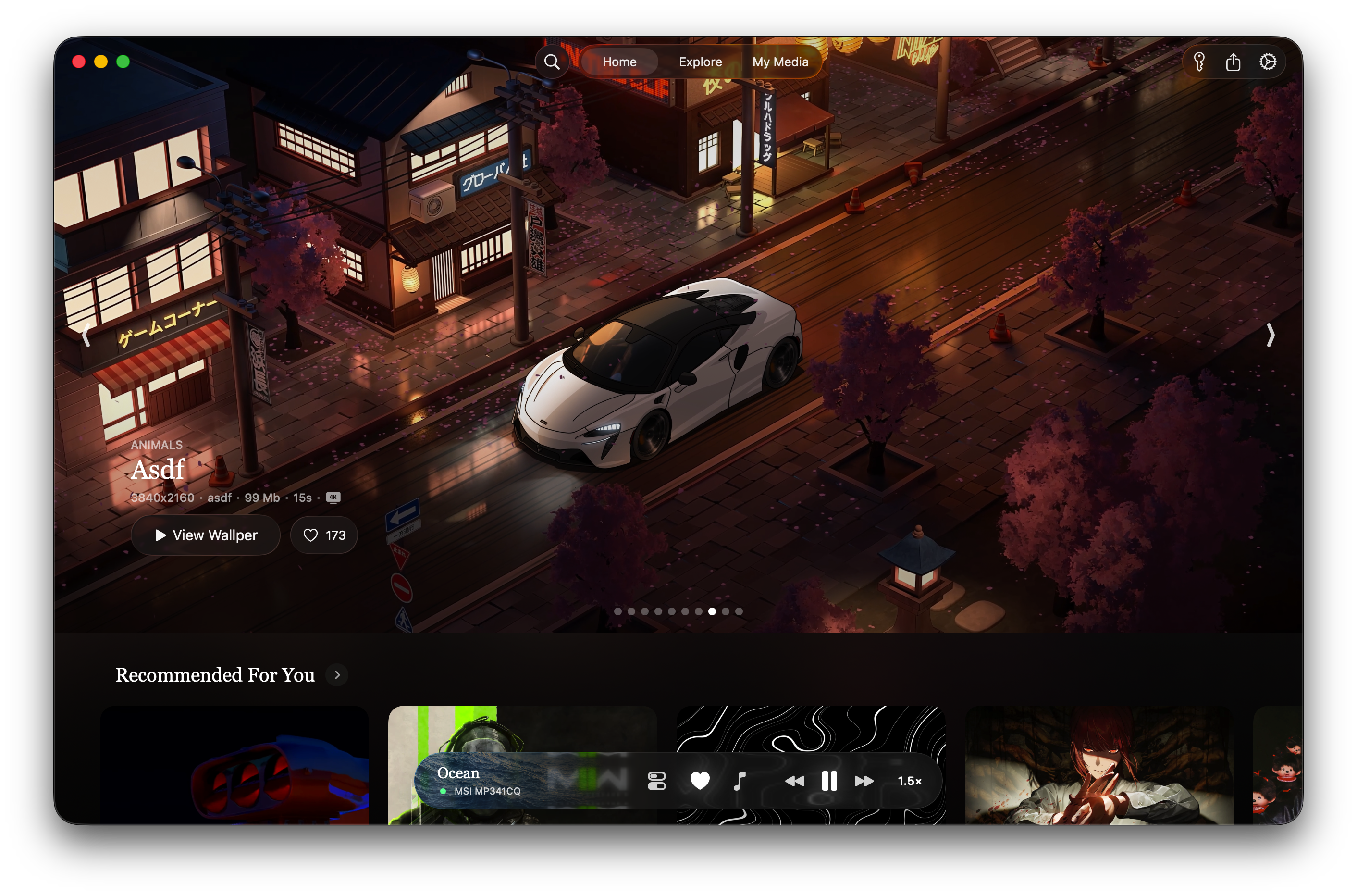 A MacBook running a Wallper 4K live wallpaper on the lock screen